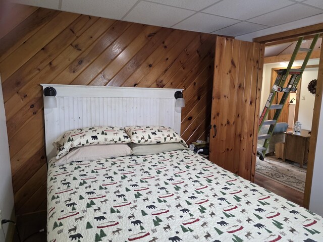 25 Oak Ridge Rd, Shirley, ME 04485 - bedroom with wood walls and a drop ceiling