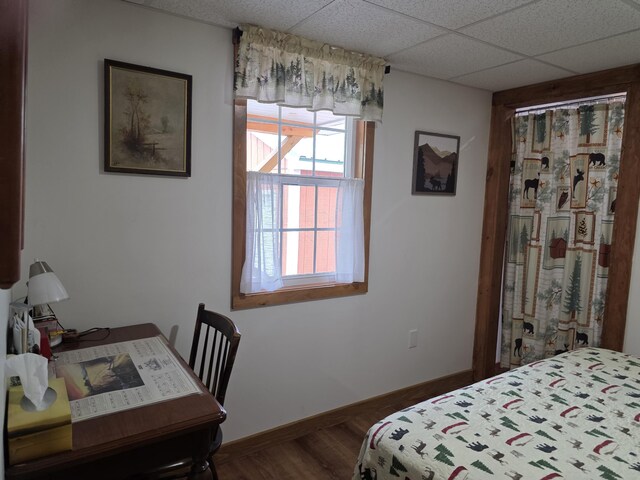 25 Oak Ridge Rd, Shirley, ME 04485 - bedroom featuring dark wood finished floors, baseboards, and a paneled ceiling