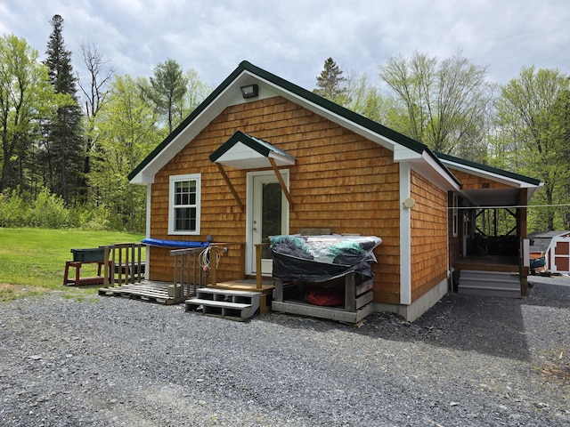 25 Oak Ridge Rd, Shirley, ME 04485 - view of front of property featuring an outbuilding and a deck