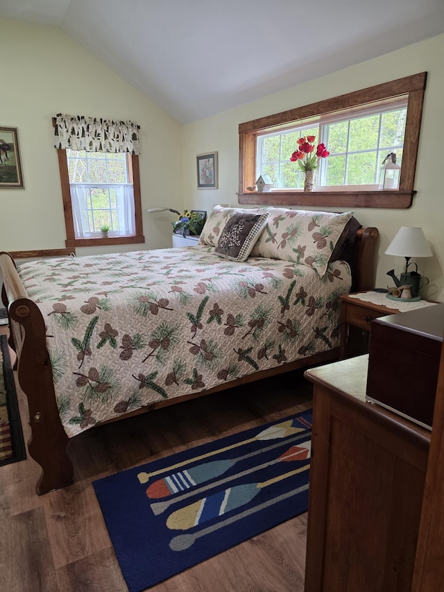 25 Oak Ridge Rd, Shirley, ME 04485 - bedroom featuring multiple windows, lofted ceiling, and wood finished floors