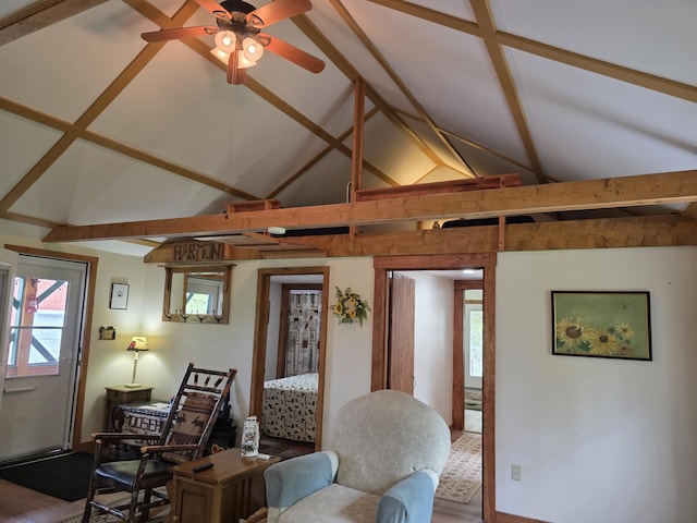 25 Oak Ridge Rd, Shirley, ME 04485 - living area featuring beam ceiling, high vaulted ceiling, ceiling fan, and wood finished floors