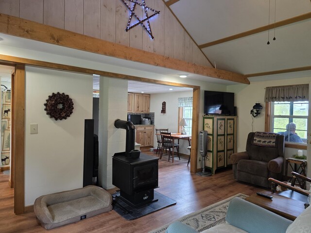 25 Oak Ridge Rd, Shirley, ME 04485 - living area with high vaulted ceiling, wood finished floors, and a wood stove
