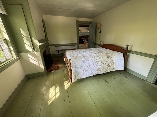 186 Bridgton Rd, Sebago, ME 04029 - bedroom featuring baseboards and wood-type flooring