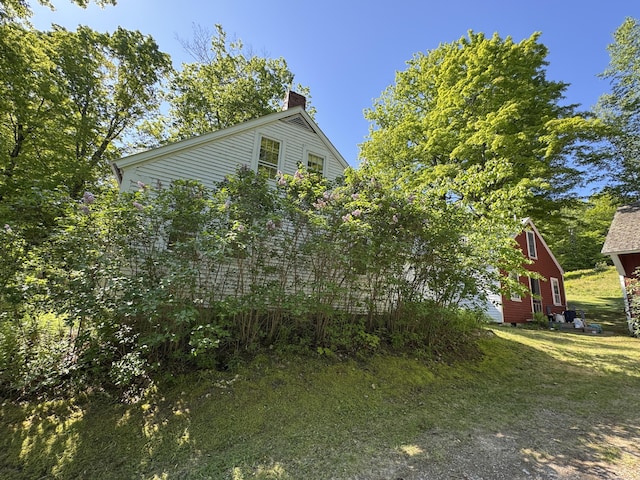 186 Bridgton Rd, Sebago, ME 04029 - view of side of property featuring a chimney