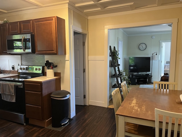 6 High St, Waterville, ME 04901 - kitchen with appliances with stainless steel finishes, dark wood finished floors, crown molding, backsplash, and light countertops