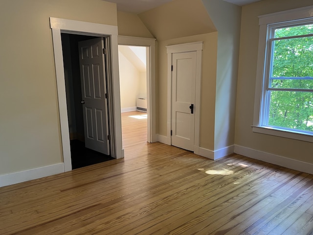 6 High St, Waterville, ME 04901 - unfurnished bedroom featuring light wood-style floors, multiple windows, and baseboards