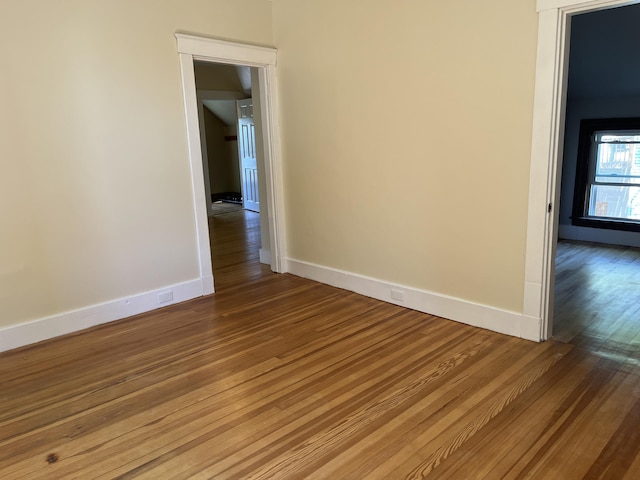 6 High St, Waterville, ME 04901 - empty room with wood finished floors and baseboards