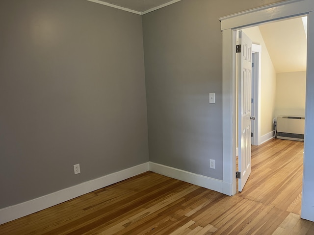 6 High St, Waterville, ME 04901 - unfurnished room featuring wood finished floors, ornamental molding, baseboards, and heating unit