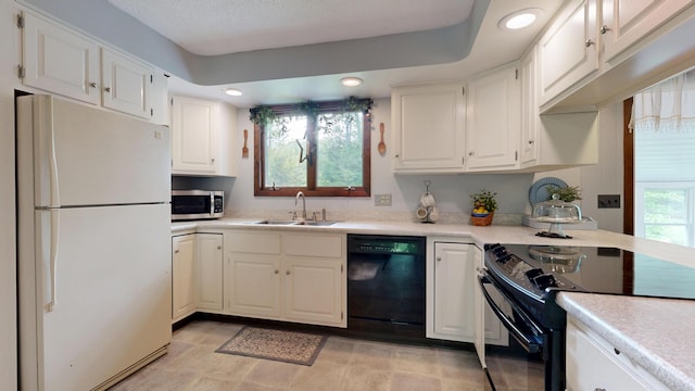 76 Parkview Ave, Livermore Falls, ME 04254 - kitchen featuring black appliances, white cabinets, light countertops, and recessed lighting