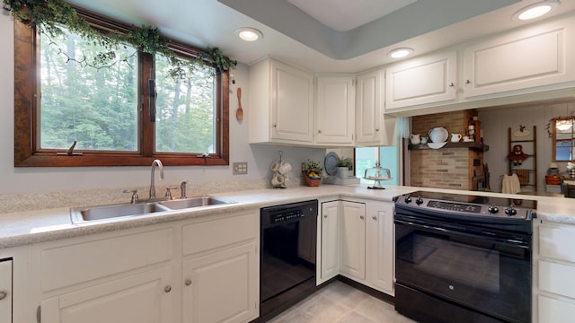 76 Parkview Ave, Livermore Falls, ME 04254 - kitchen with black appliances, light countertops, white cabinetry, recessed lighting, and light tile patterned floors