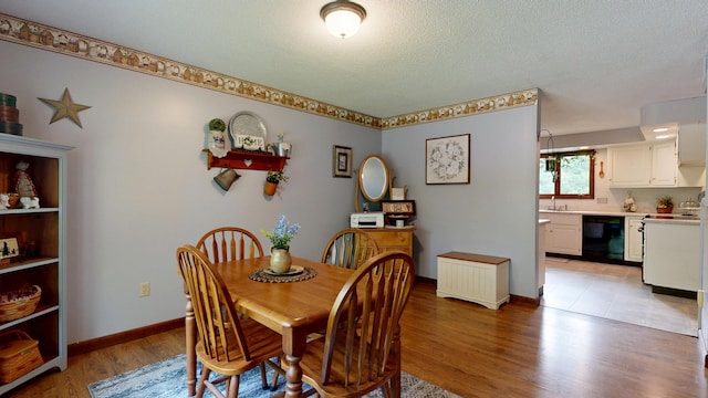 76 Parkview Ave, Livermore Falls, ME 04254 - dining room featuring light wood finished floors and a textured ceiling