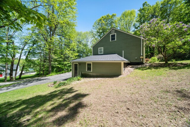 3 Wilson Ln, Saco, ME 04072 - view of side of home featuring a yard and asphalt driveway