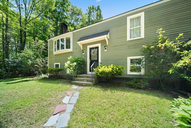 3 Wilson Ln, Saco, ME 04072 - raised ranch with a chimney and a front yard
