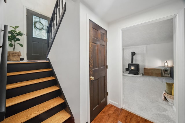 3 Wilson Ln, Saco, ME 04072 - stairs with a wood stove and wood finished floors