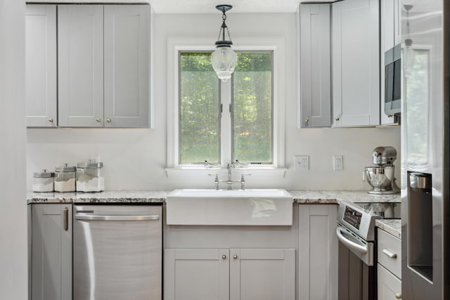 3 Wilson Ln, Saco, ME 04072 - kitchen with appliances with stainless steel finishes, a sink, decorative light fixtures, and light stone counters