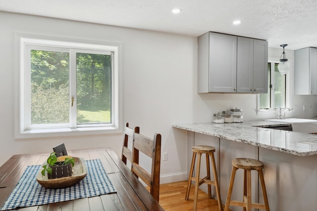 3 Wilson Ln, Saco, ME 04072 - dining space featuring light wood-type flooring, recessed lighting, a textured ceiling, and baseboards
