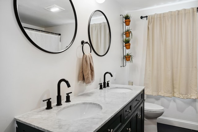 3 Wilson Ln, Saco, ME 04072 - bathroom with double vanity and toilet