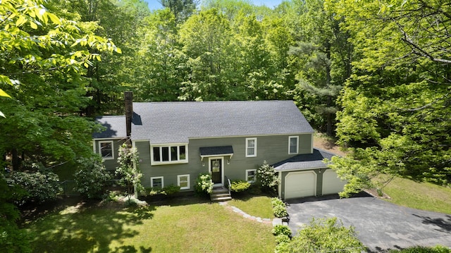 3 Wilson Ln, Saco, ME 04072 - raised ranch with asphalt driveway, roof with shingles, a garage, and a front yard