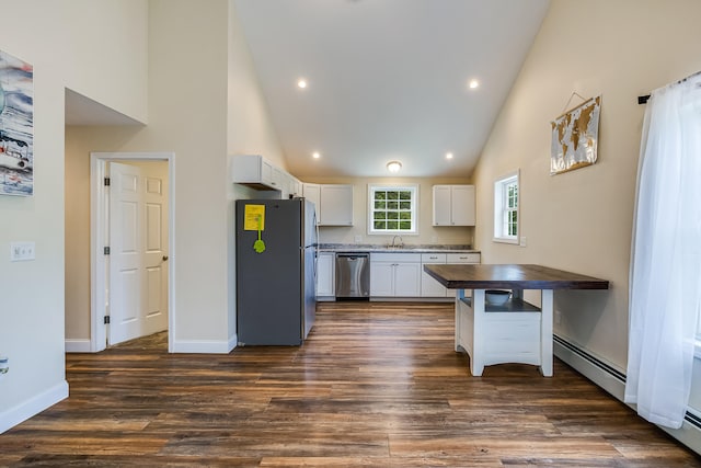 711 Newfield Rd, Shapleigh, ME 04076 - kitchen with appliances with stainless steel finishes, a sink, white cabinets, high vaulted ceiling, and dark wood-type flooring