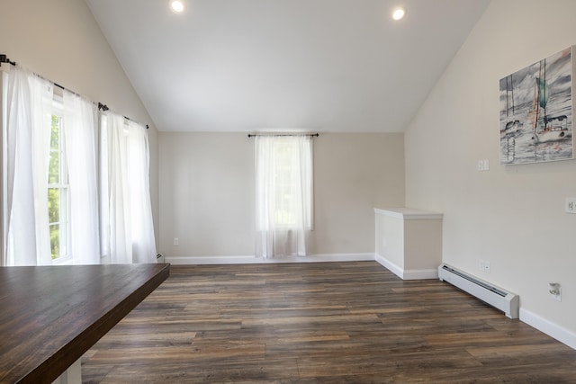 711 Newfield Rd, Shapleigh, ME 04076 - unfurnished room featuring a baseboard heating unit, vaulted ceiling, healthy amount of natural light, dark wood-style floors, and recessed lighting