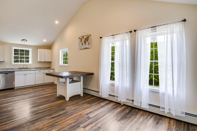 711 Newfield Rd, Shapleigh, ME 04076 - kitchen with stainless steel dishwasher, a sink, dark wood finished floors, white cabinets, and high vaulted ceiling