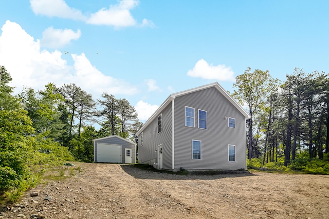 711 Newfield Rd, Shapleigh, ME 04076 - view of property exterior featuring an outbuilding, a detached garage, and driveway