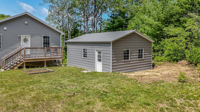 711 Newfield Rd, Shapleigh, ME 04076 - rear view of house with an outbuilding, a lawn, and a wooden deck