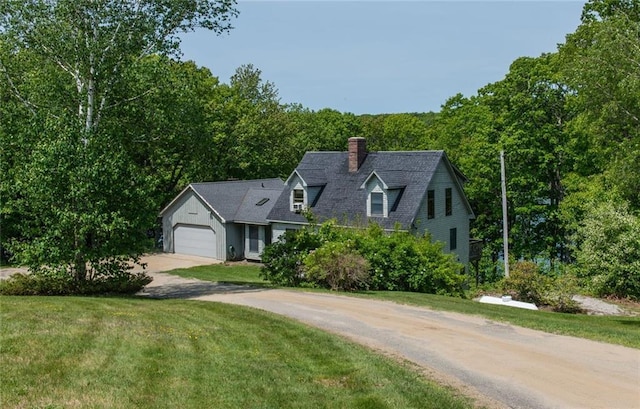 81 Bryers Cir, Boothbay, ME 04537 - new england style home featuring concrete driveway, a chimney, a garage, and a front yard