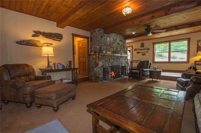 81 Bryers Cir, Boothbay, ME 04537 - living area featuring carpet floors, a wooden ceiling with exposed beams, a stone fireplace, and a ceiling fan