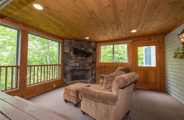 81 Bryers Cir, Boothbay, ME 04537 - carpeted living area with wood ceiling, wooden walls, a fireplace, and recessed lighting