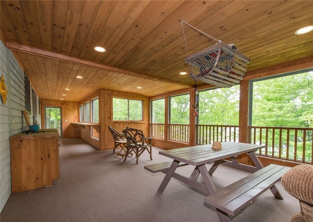 81 Bryers Cir, Boothbay, ME 04537 - sunroom with wood ceiling, wooden walls, carpet floors, outdoor dining space, and recessed lighting
