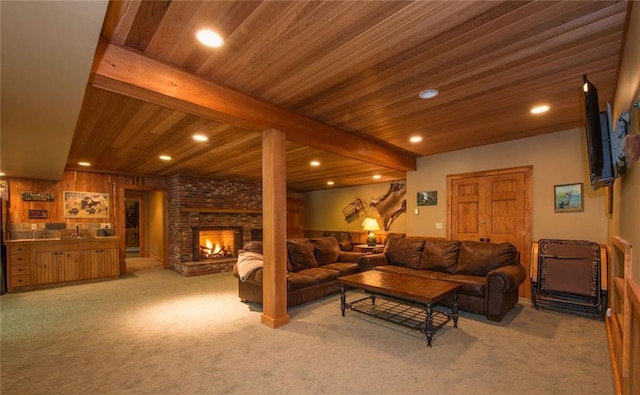 81 Bryers Cir, Boothbay, ME 04537 - living area featuring light carpet, a brick fireplace, recessed lighting, and a wood ceiling with exposed beams