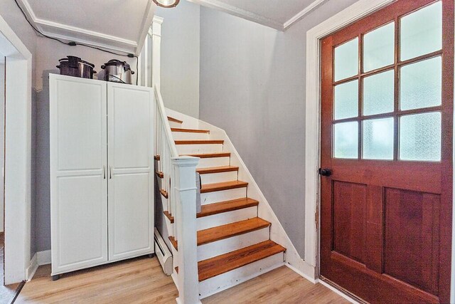 128 Benton Ave, Winslow, ME 04901 - stairway featuring wood finished floors and crown molding