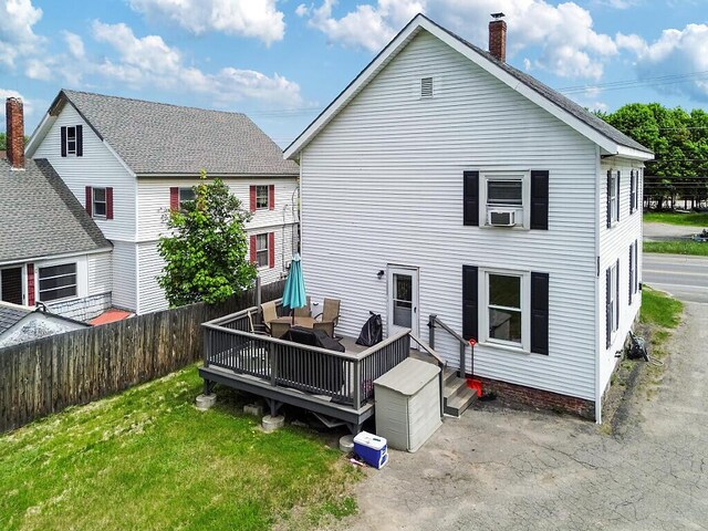 128 Benton Ave, Winslow, ME 04901 - rear view of property featuring a deck, a chimney, and an outdoor living space