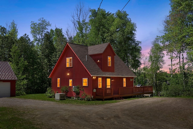 80 Hart St, Newport, ME 04953 - view of front of home with dirt driveway, central air condition unit, an outbuilding, and a wooden deck