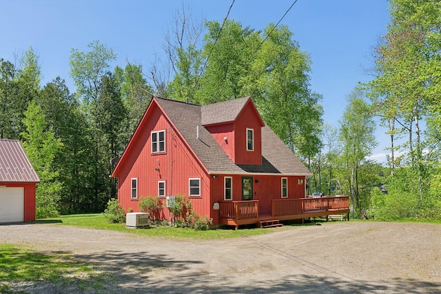 80 Hart St, Newport, ME 04953 - view of front facade featuring roof with shingles, a wooden deck, an outdoor structure, and driveway