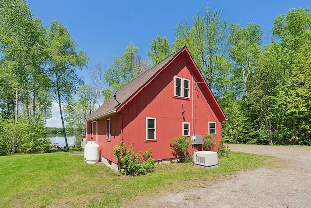 80 Hart St, Newport, ME 04953 - view of side of home featuring a yard, a water view, and a shingled roof