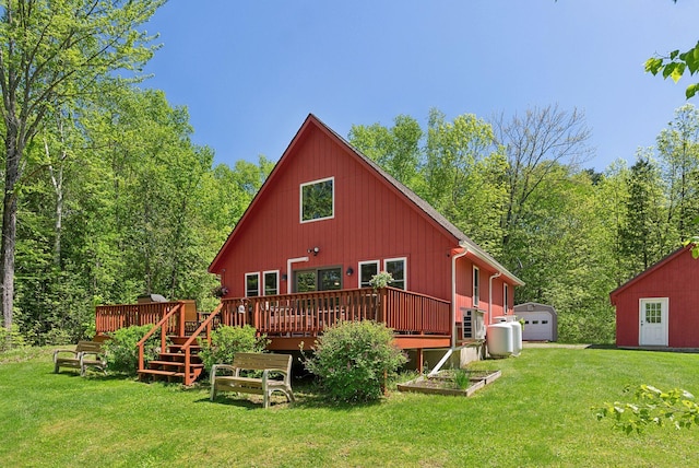 80 Hart St, Newport, ME 04953 - rear view of property with a lawn, an outbuilding, a wooden deck, and a wooded view
