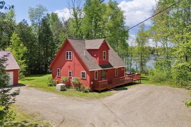 80 Hart St, Newport, ME 04953 - view of front of house featuring a shingled roof, dirt driveway, and a deck with water view