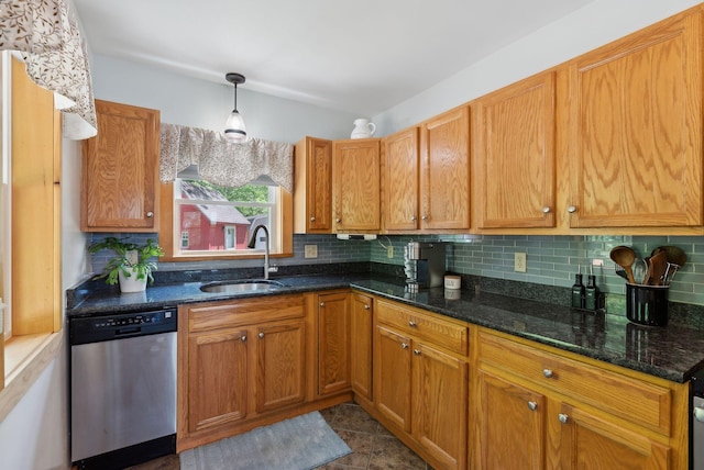 80 Hart St, Newport, ME 04953 - kitchen with stainless steel dishwasher, a sink, backsplash, dark stone counters, and brown cabinetry