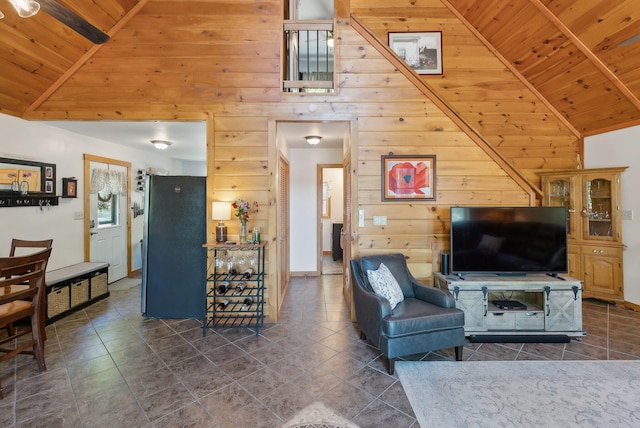 80 Hart St, Newport, ME 04953 - tiled living room with wood ceiling with exposed beams, wooden walls, and high vaulted ceiling