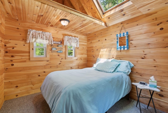 80 Hart St, Newport, ME 04953 - bedroom with carpet floors, a skylight, wood walls, and wood ceiling with exposed beams