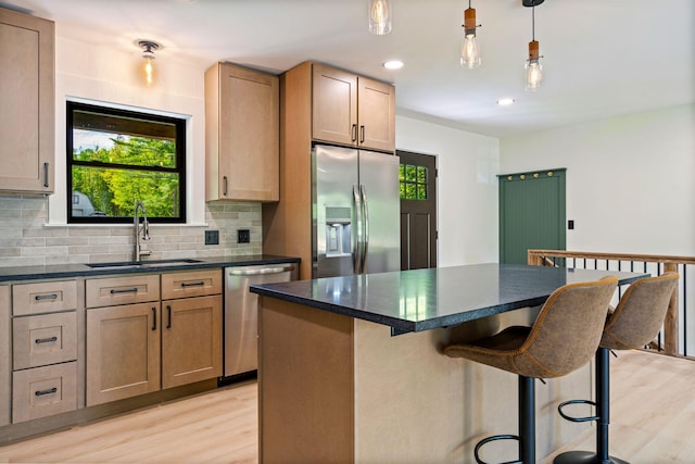 734 Main Rd, Charleston, ME 04422 - kitchen featuring stainless steel appliances, light wood-type flooring, healthy amount of natural light, and recessed lighting