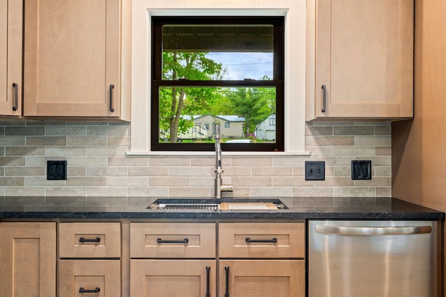 734 Main Rd, Charleston, ME 04422 - kitchen with stainless steel dishwasher, tasteful backsplash, and dark stone countertops