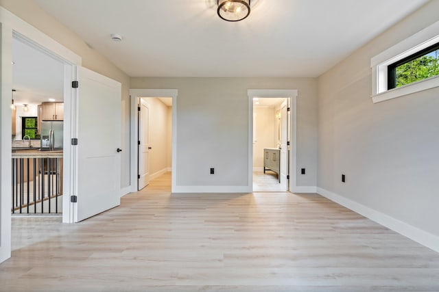 734 Main Rd, Charleston, ME 04422 - unfurnished room with light wood-style floors and a smoke detector
