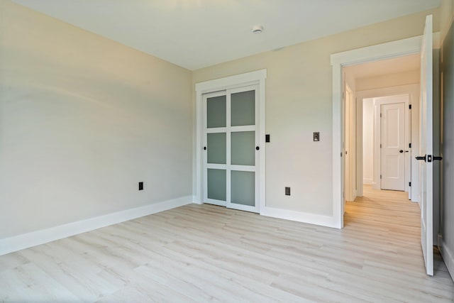 734 Main Rd, Charleston, ME 04422 - empty room featuring light wood-style flooring and a smoke detector