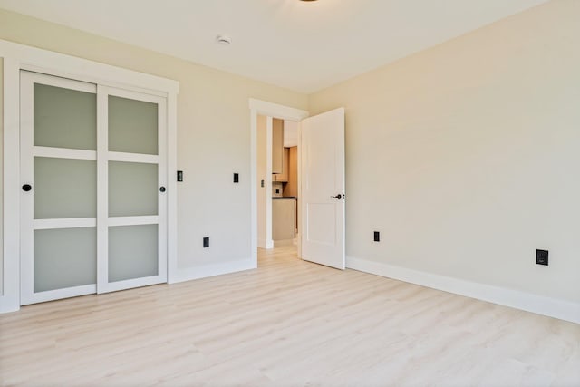 734 Main Rd, Charleston, ME 04422 - unfurnished bedroom featuring light wood-style flooring and a closet