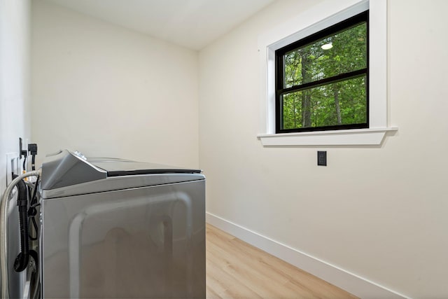 734 Main Rd, Charleston, ME 04422 - laundry room featuring light wood-type flooring and washing machine and clothes dryer