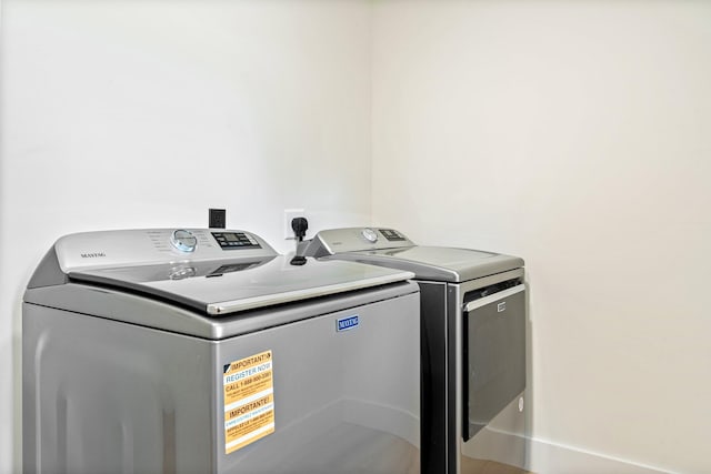 734 Main Rd, Charleston, ME 04422 - laundry area featuring washing machine and clothes dryer