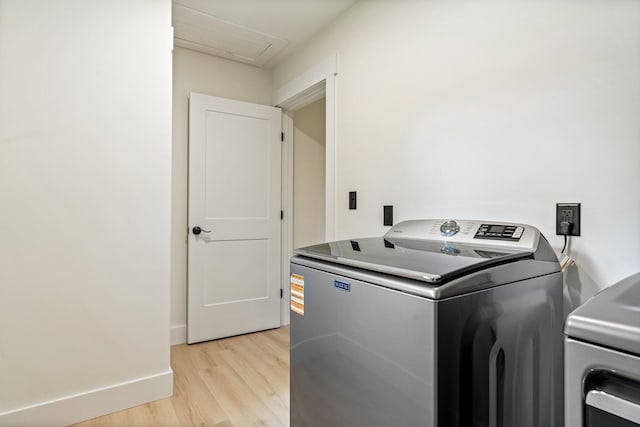734 Main Rd, Charleston, ME 04422 - laundry area with light wood-type flooring